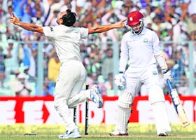 Mohammed Shami celebrates the dismissal of Ramdin at Eden Gardens on Wednesday. Shami picked up four wickets to give India the edge