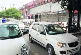 Cars parked in front of a bus stop at Sector 11, Panchkula