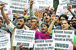 Members of JNU Students Union hold placards during a demonstration at Jantar Mantar in New Delhi on Thursday