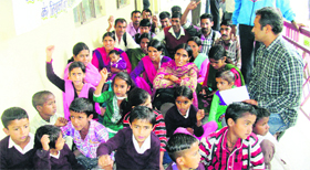 Students of Government Primary School, Bangala village, near Kotdwar, stage a protest on Thursday.