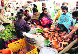 Devotees make purchases for Chhath puja in Gurgaon on Thursday.
