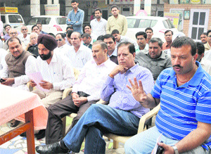 Members of social organisations address mediapersons in Karnal on Thursday, saying that the principal has been falsely implicated in the case. 