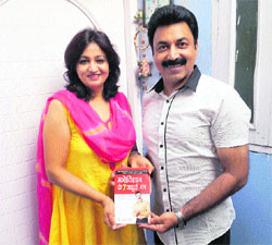 Dr Ravinder Puri and his wife Mona Puri show the book, "Manovigyan ke Saat Jaadui Mantras, in Sirsa. 