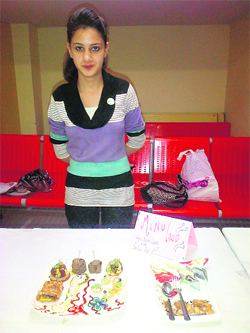 A participant with the food items displayed during the health exhibition on the World Nutrition Day in Ludhiana.