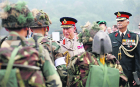 Prince Charles of Wales meets soldiers at the IMA, Dehradun, on Thursday.