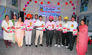 Government Polytechnic College staff releases a placement brochure in Bathinda on Friday.