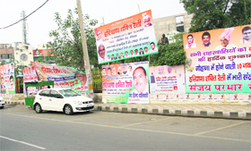 Posters and hoardings near D-Park on the Delhi road in Rohtak on Friday.