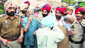 Convicted doctors come out of the court after their sentencing in Amritsar.