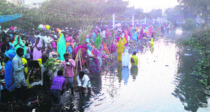 Devotees perform rituals during Chhath Puja in Phagwara on Friday. 