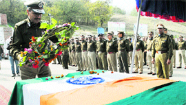 CRPF Inspector General pays tributes to the two slain CRPF men during a wreath-laying ceremony at Humhama in Srinagar on Friday.