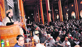 Separatist leader Mirwaiz Umar Farooq addresses people at Jamia Masjid in Srinagar on Friday.