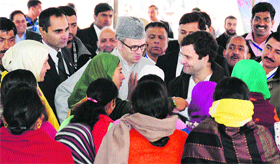 Congress vice-president Rahul Gandhi and Chief Minister Omar Abdullah interact with members of women self-help groups under the Umeed scheme in Budgam district.