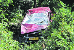 The taxi that fell into a gorge near Nagrota on Friday. Tribune photo