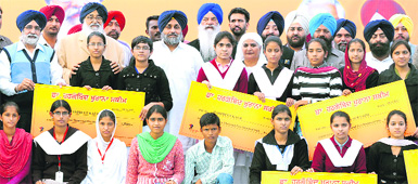 Chief Minister Parkash Singh Badal, Deputy Chief Minister Sukhbir Badal and Education Minister Sikander Singh Maluka with the awardees during the launch of a scholarship scheme in Jalandhar on Friday. 