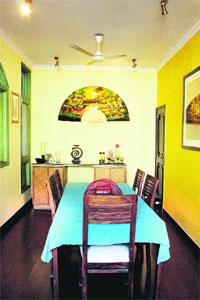 Thai fan from Bangkok adorns the dining room wall