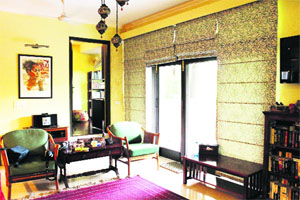 Light fills the living room from the balcony