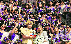 Sri Lankan couple Nisansala and Nalin with their 126 bridesmaids and 25 best men during their wedding in Negombo on Friday. They broke the Guinness record for a wedding with the most bridesmaids