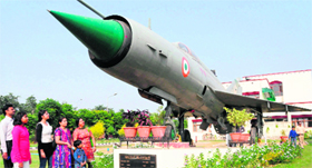 Supersonic delight: Residents have a look at the MIG-21 fighter plane during the Army Weapon Exhibition held at Maharaja Ranjit Singh Armed Forces Preparatory Institute, Sector 77, Mohali, on Saturday. 