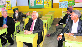 Back to the classroom: Union Law Minister Kapil Sibal (in the middle) shares a light moment with his 1963 batch mates in his old classroom at St Johns School in Sector 26 on the occasion of his batchs golden jubilee commemoration. Along with him are his fellow classmates Charanjit Singh Wahan (right side front), Rajinder Singh (next to Charanjit), Sanjiv Krishan (left side front) and Nripjit Singh Chawla (right side back).