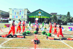 Students give a presentation during the annual sports day function at St Judes School in Dehradun on Saturday. A Tribune photograph