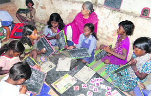 Vijaya Ramachandran with students of Apna Skool at a brick-kiln site.