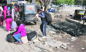 The dilapidated condition of the road outside the railway station in Jammu on Saturday.