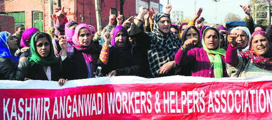 Members of Anganwadi Workers and Helpers Association, Kashmir province, protest in support of their long-pending demands at the Lal Chowk in Srinagar on Saturday.