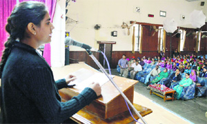 A girl addresses a gathering during the legal literacy seminar in Ludhiana on Saturday. 