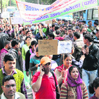 Contractual Power employees taking out a march in support of their demands in Dehradun on Saturday