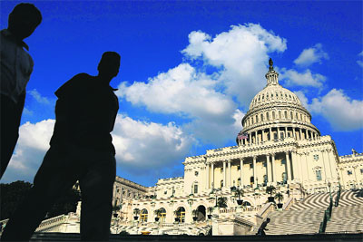 Tourists walk past the US Capitol Dome in Washington.