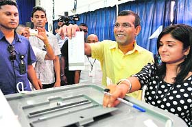 Maldivian presidential candidate Mohamed Nasheed casts his vote in Male