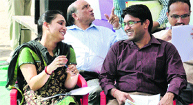 The husband-wife IAS duo of municipal commissioner Vipul Ujjawal and SDM Sonali Giri share a light moment while waiting for the sangat darshan programme in Bathinda on Sunday.