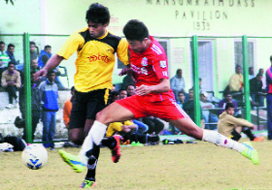 A match in progress during the Drona College 70th Nemidas Memorial District Football League at Pavillion Ground in Dehradun on Sunday. 