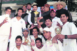 The Asian School team with the Patidas Singh Memorial GTM Twenty20 Cricket Challenger Trophy at Doon Global School in Dehradun on Sunday. 