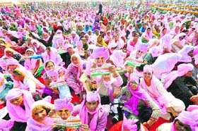Hooda supporters with his masks at Gohana on Sunday