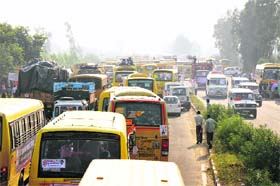Vehicles stuck in a traffic jam after the rally on the Gohana bypass