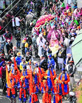 Devotees take part in a procession for Guru Nanak Dev's Parkash Utsav in Shimla on Saturday