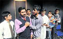 Artistes enact a scene from the play Zameen Ka Sawal in Jammu on Sunday