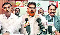 Members of the Batwal Welfare Society addresses mediapersons in Jammu on Sunday