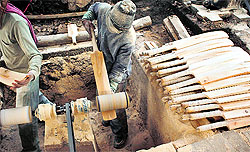 Workers give finishing touches to bats at a manufacturing unit in Avantipora district on Sunday