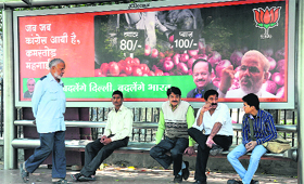 A BJP hoarding at a bus stand in New Delhi on Sunday.