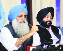 Virsa Singh Valtoha (left) and Inderbir Bolaria at a press conference in Amritsar on Sunday.