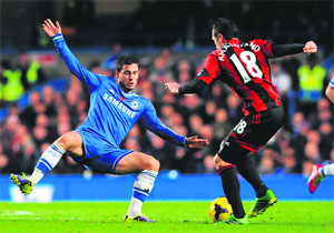 Chelsea's Eden Hazard (blue) scored a late goal to salvage a draw against West Bromwich Albion on Sunday.
