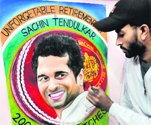 Artist Rubel gives final touches to his creation of Sachin Tendulkar, who will retire after playing his 200th Test in Mumbai shortly.