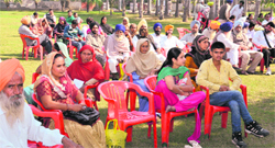 Litigants await hearing of their cases by the Punjab State Womens Commission members at the Field Hostel in Thermal Colony on Monday; and Paramjit Kaur, the chairman of the commission, along with Veerpal Kaur. Tribune photos: Pawan Sharma