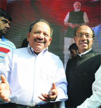BJP Delhi CM candidate Harsh Vardhan with party state president Vijay Goel during the launch of 3-D video rath for campaigning in New Delhi on Monday. 
