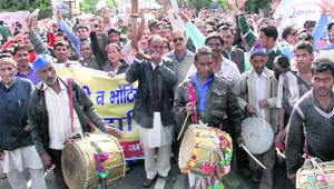 Members of the four tribal communities take out a protest march in support of their demands in Dehradun on Monday. 