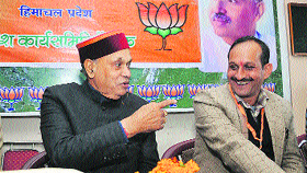 Ex-CM PK Dhumal and state party president Satpal Singh Satti during a BJP SCs Morcha meeting at Chakkar in Shimla on Monday.