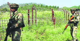 Security personnel patrol along the border in the Jammu region.