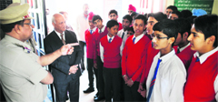 Students pay a visit to the Division No. 5 police station on the first day of Visitors Week in Ludhiana on Monday. Tribune photo